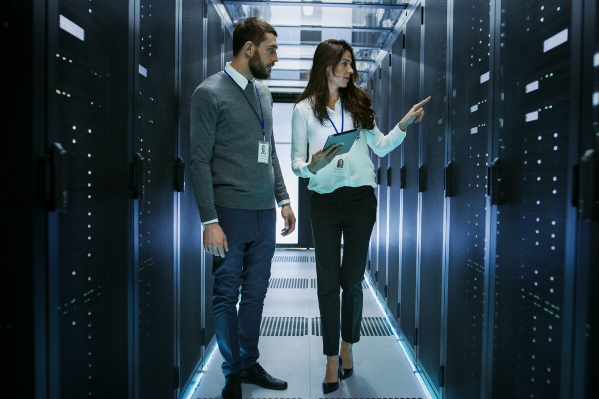 Canada's top IT staffing agency specializing in tech staffing and talent acquisition — photo of two IT professionals that were hired for permanent employment.